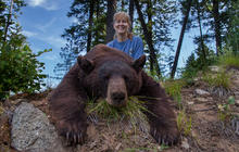 woman with her brown bear June 2015