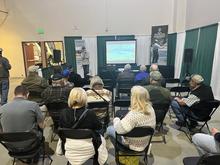 A fisheries biologist gives a presentation about kokanee management at the Idaho Sportsman Show