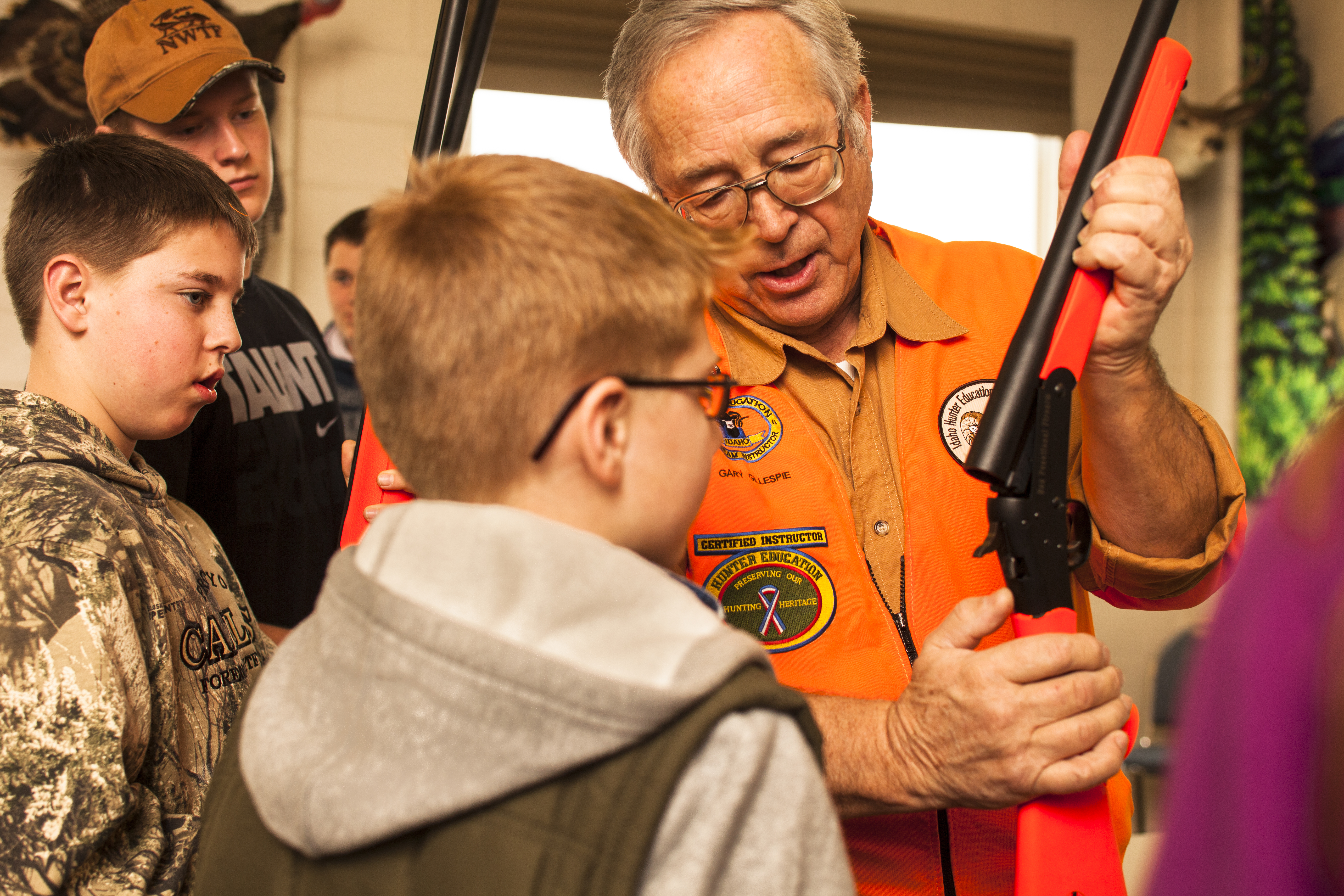 Gary Gillespie instructs students on hunter responsibility and how to use a rifle during a Hunter Education class January 2014
