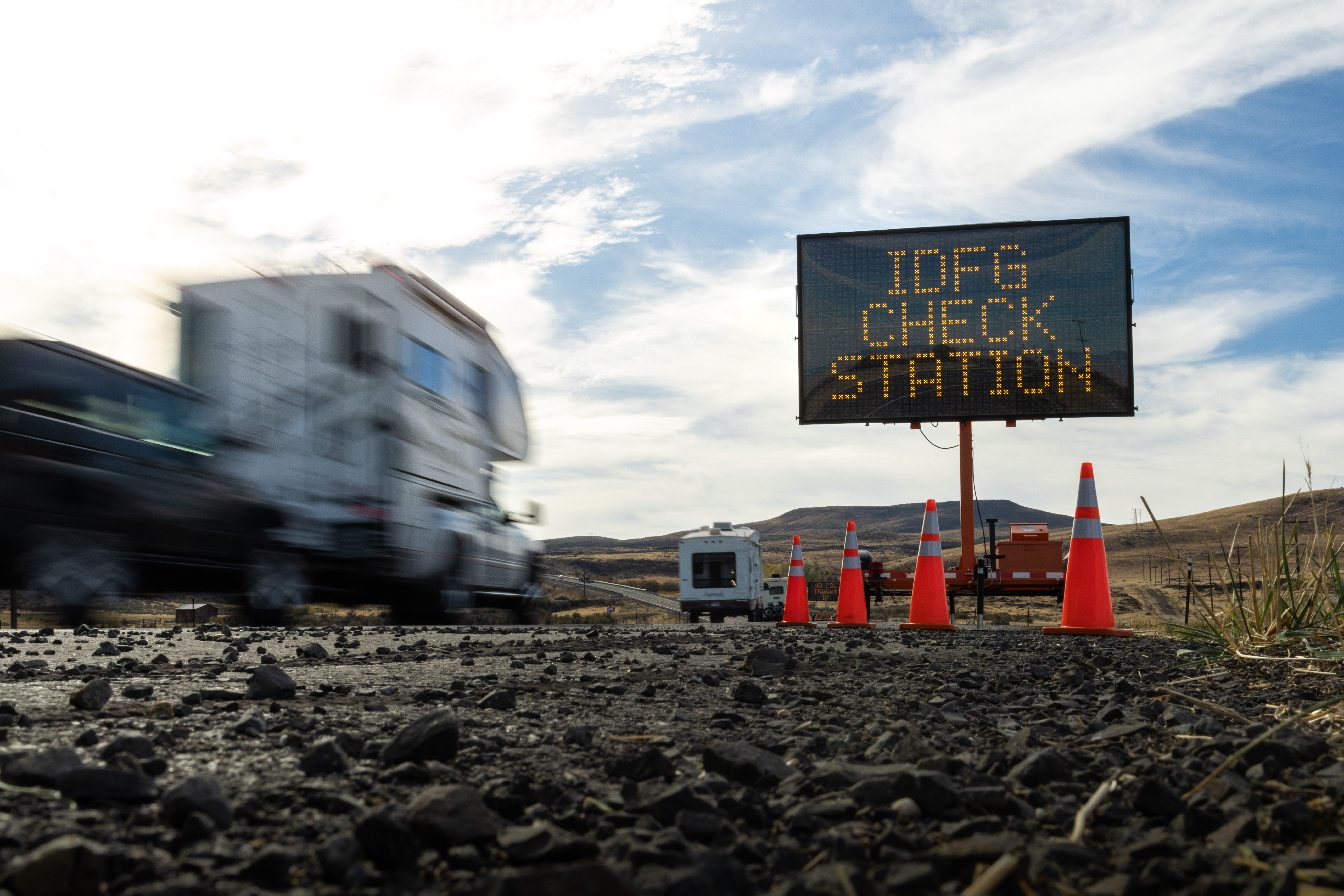 IDFG check station signage board along a roadway