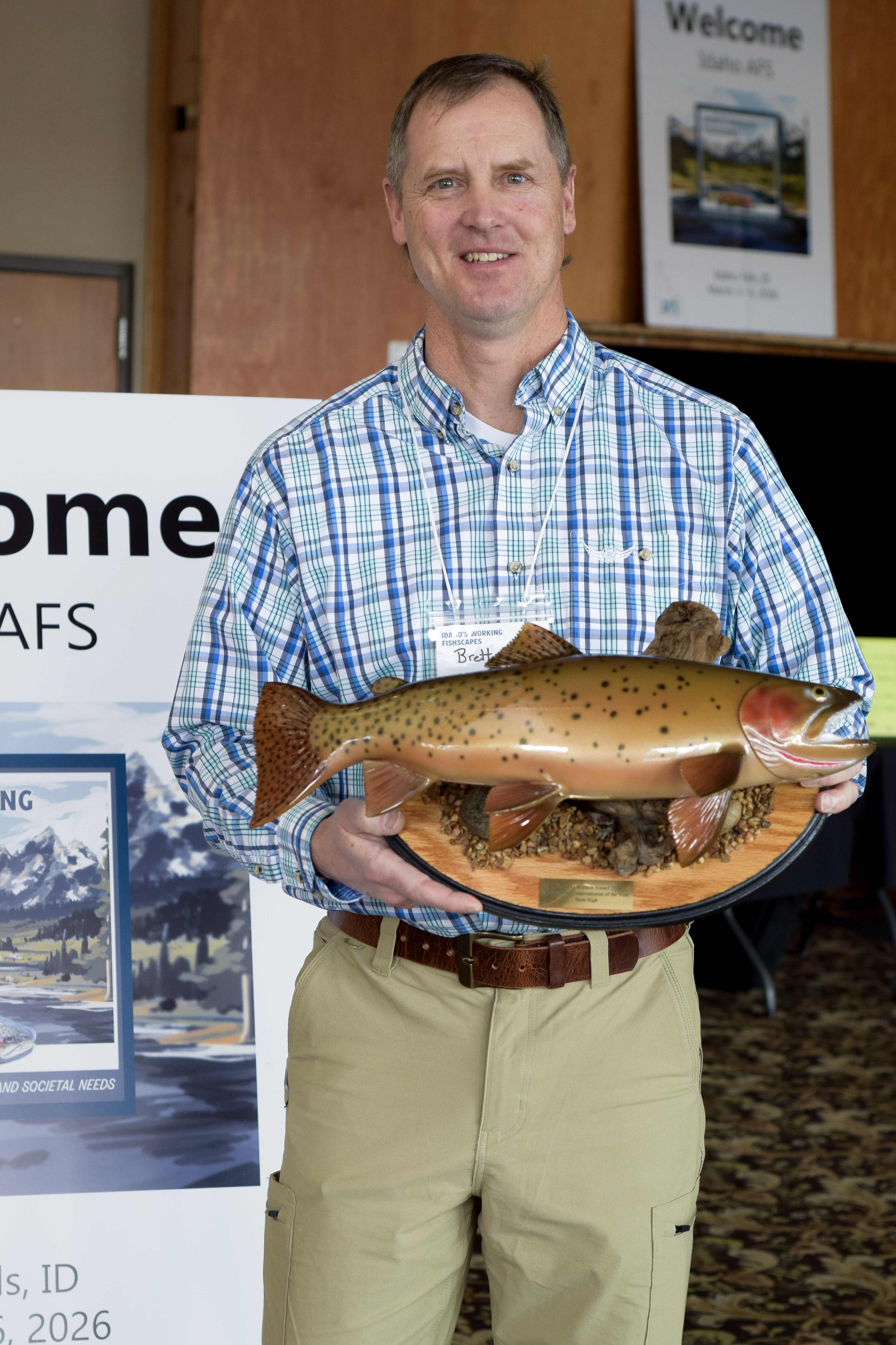 Fisheries Manager Brett High holding his Richard L. Wallace Native Fish Conservationist of the Year award