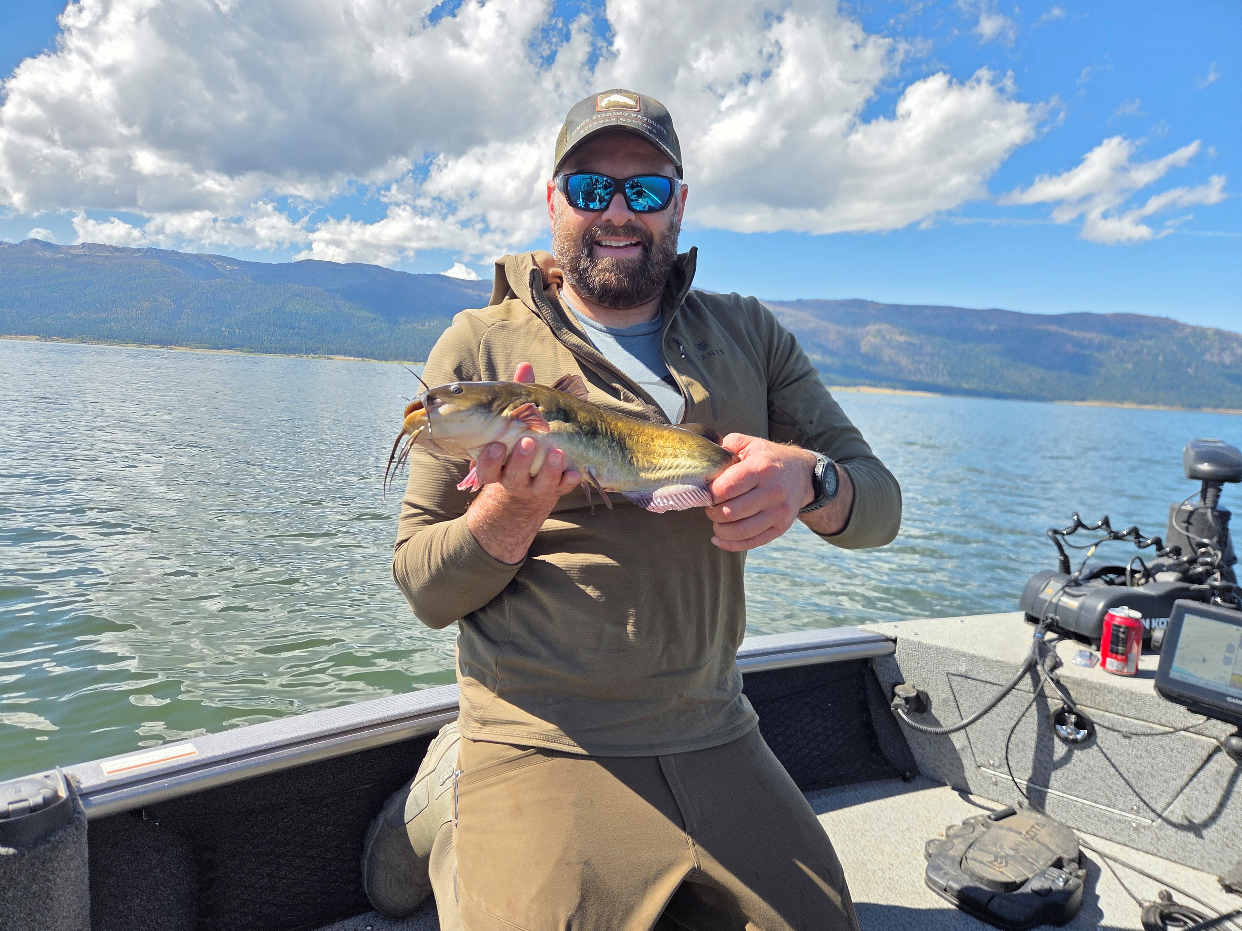 Josh DeLong with a catch-and-release state record bullhead catfish from 2026