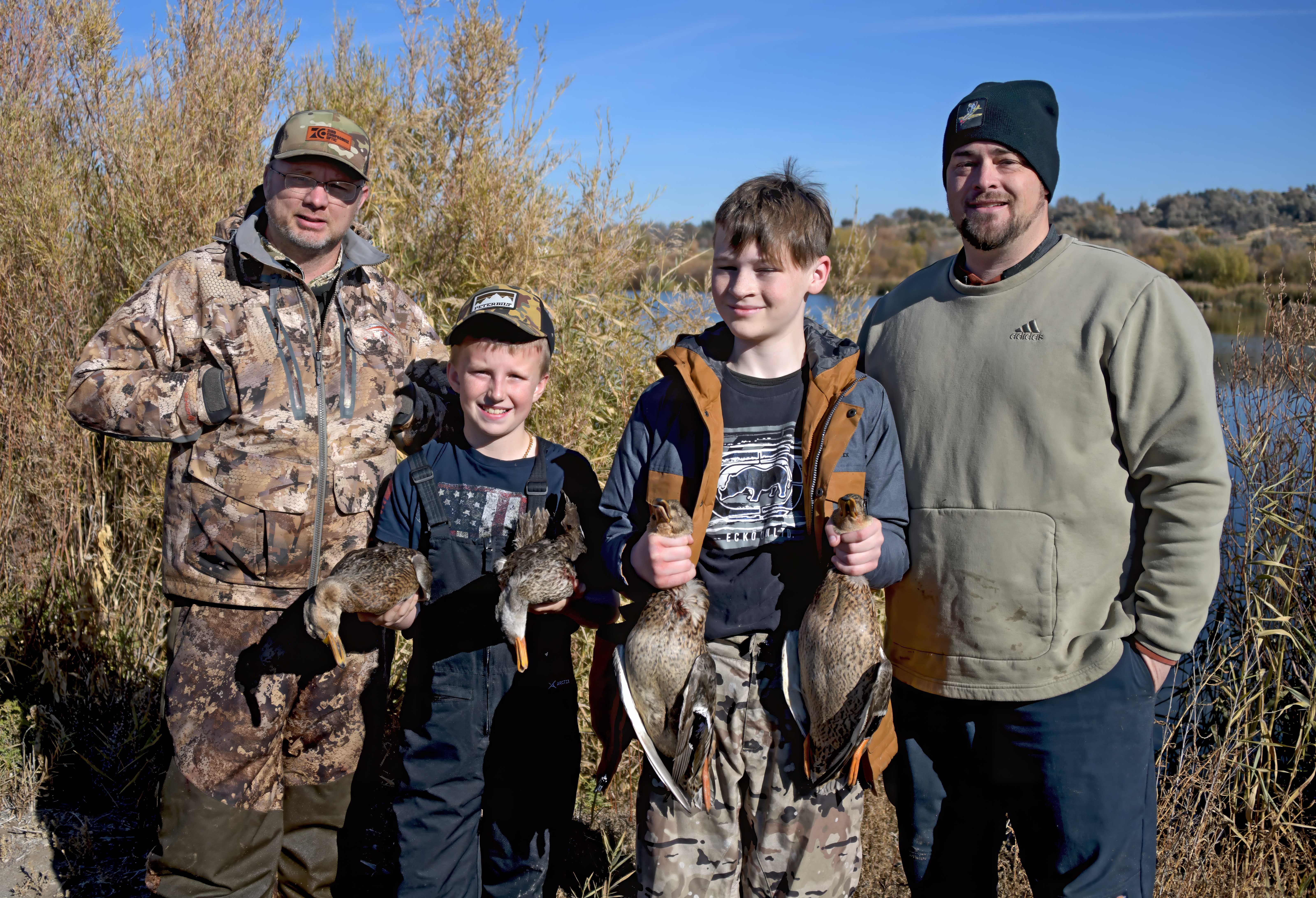 Two young boys with their mentors at the youth duck hunt at the Hagerman WMA November 2024