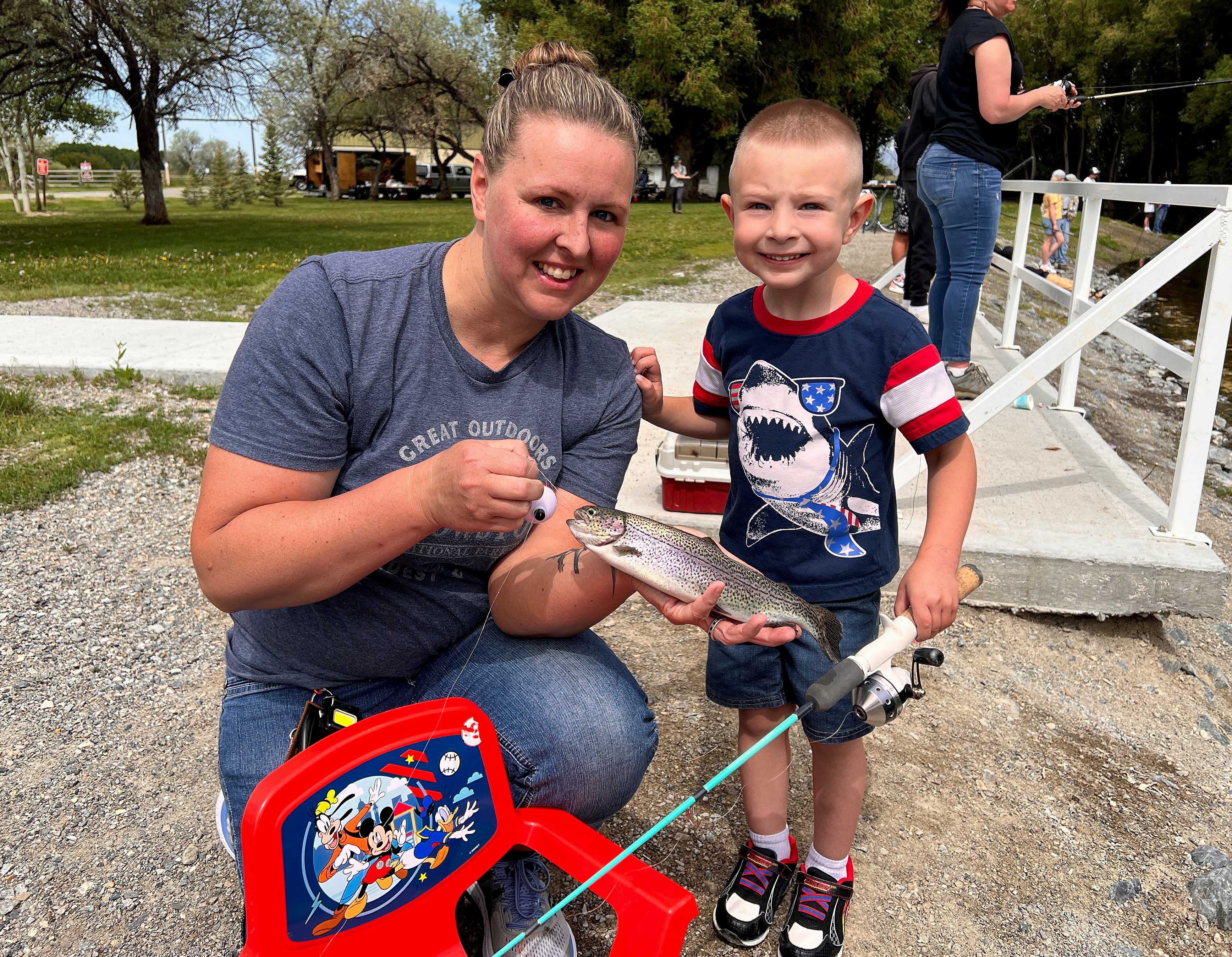 A young boy catches a rainbow trout at Gavers Lagoon in the Magic Valley Region