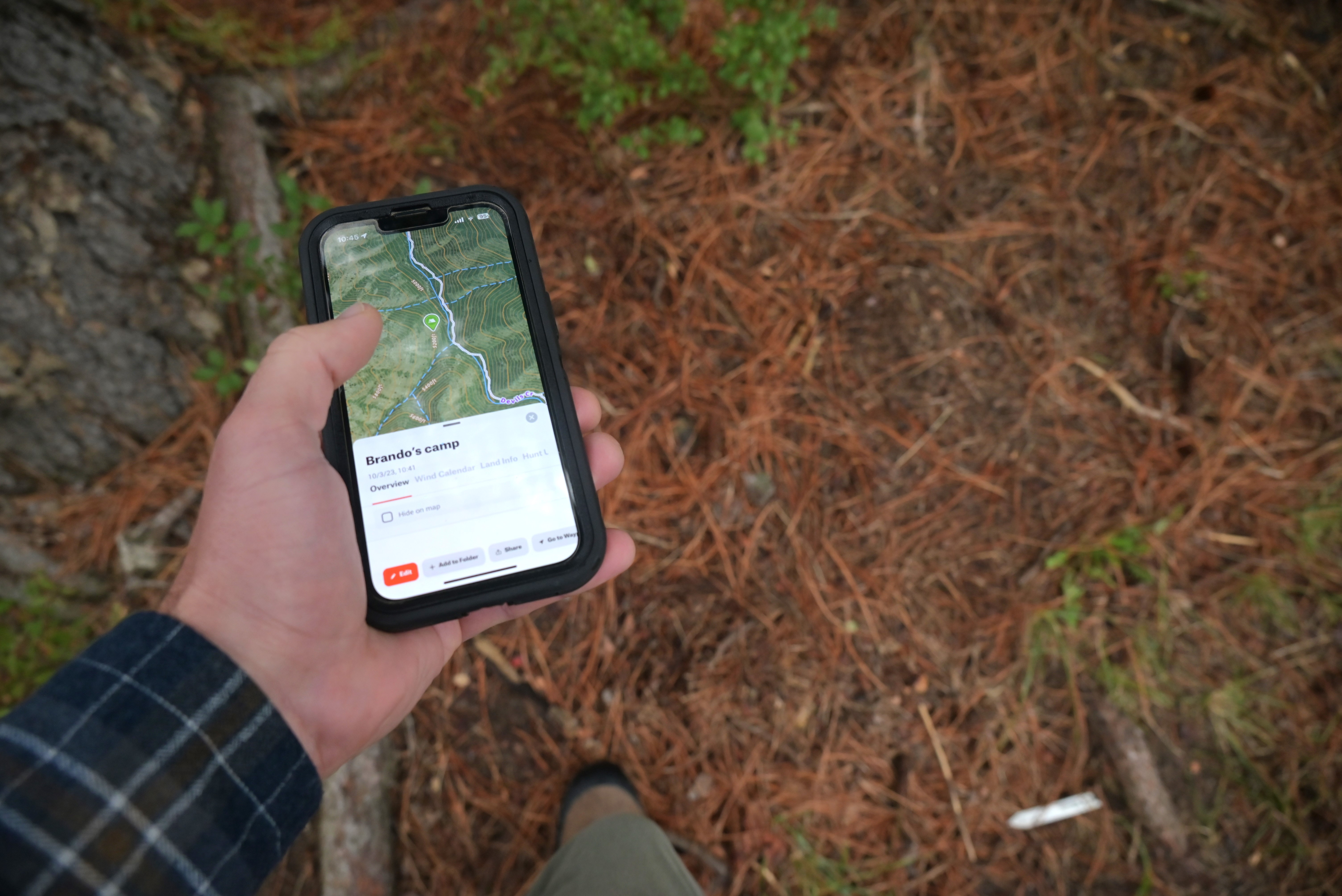 hunter using their cellphone to check gps location