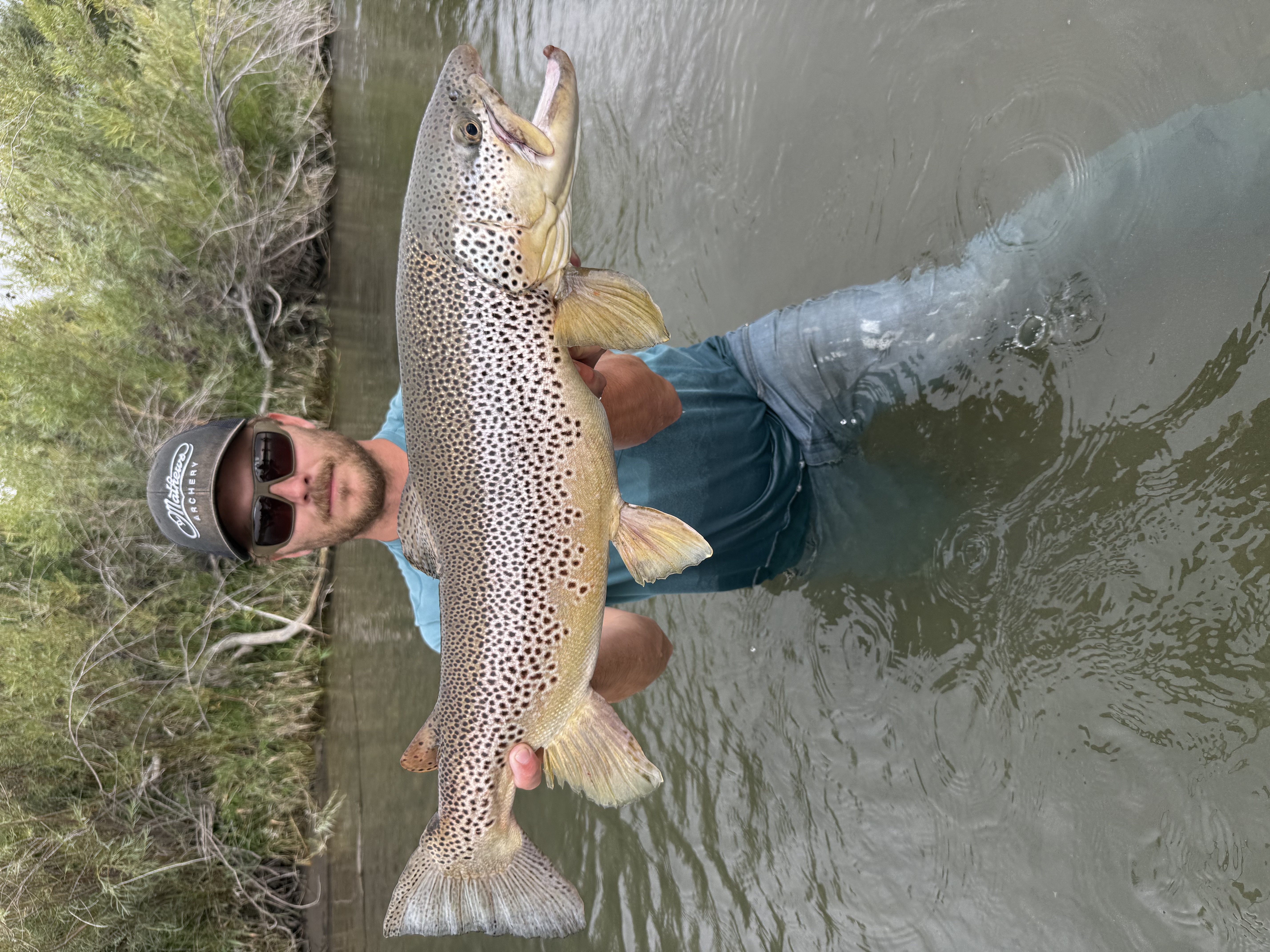 Angler Benjamin Smith with his record brown trout at Bear River 2026
