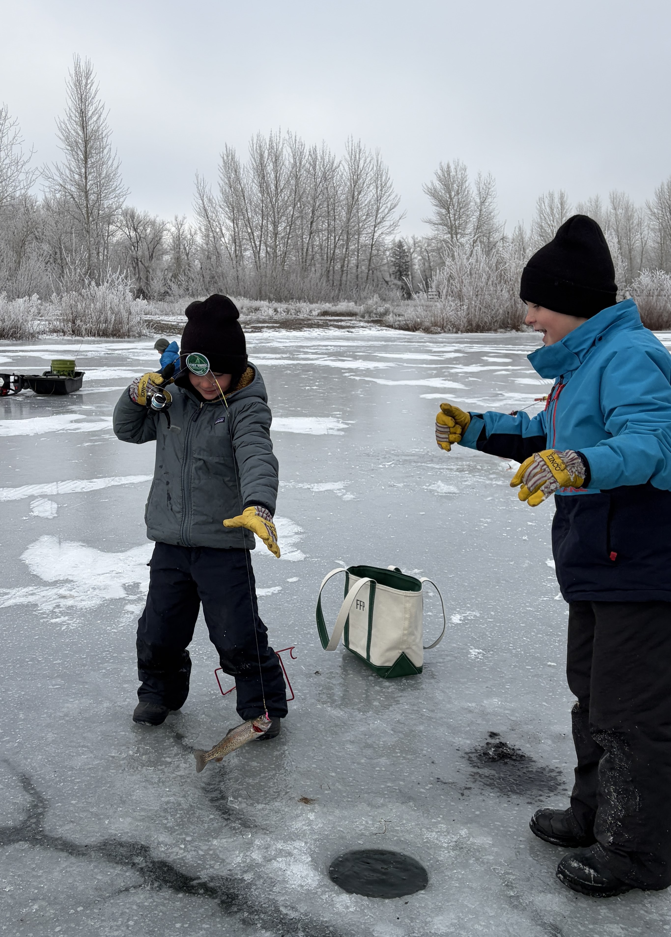 Two local anglers enjoying ice fishing on Johnson Pond