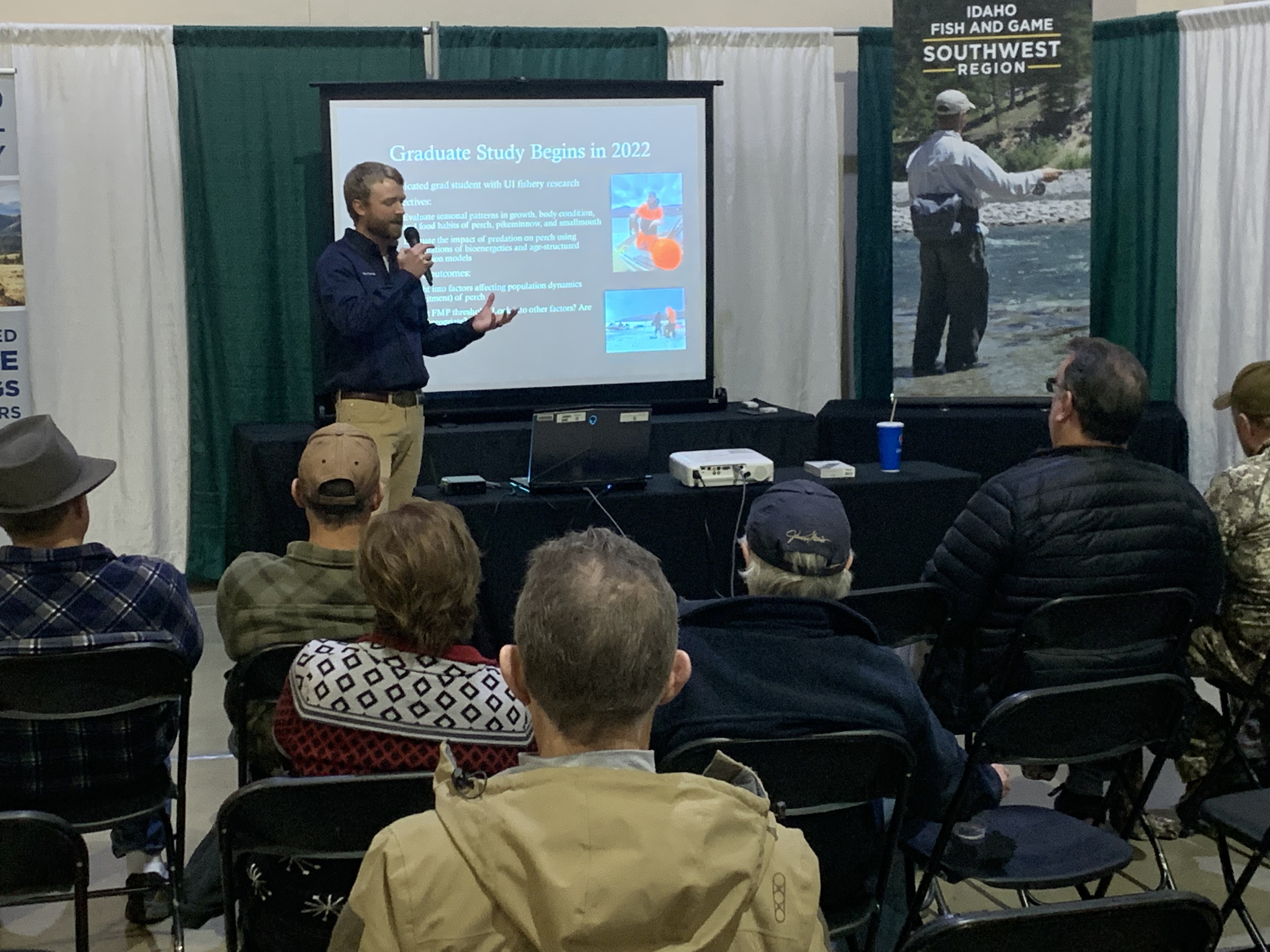 A fisheries biologist gives a presentation about Lake Cascade perch management at the Idaho Sportsman Show