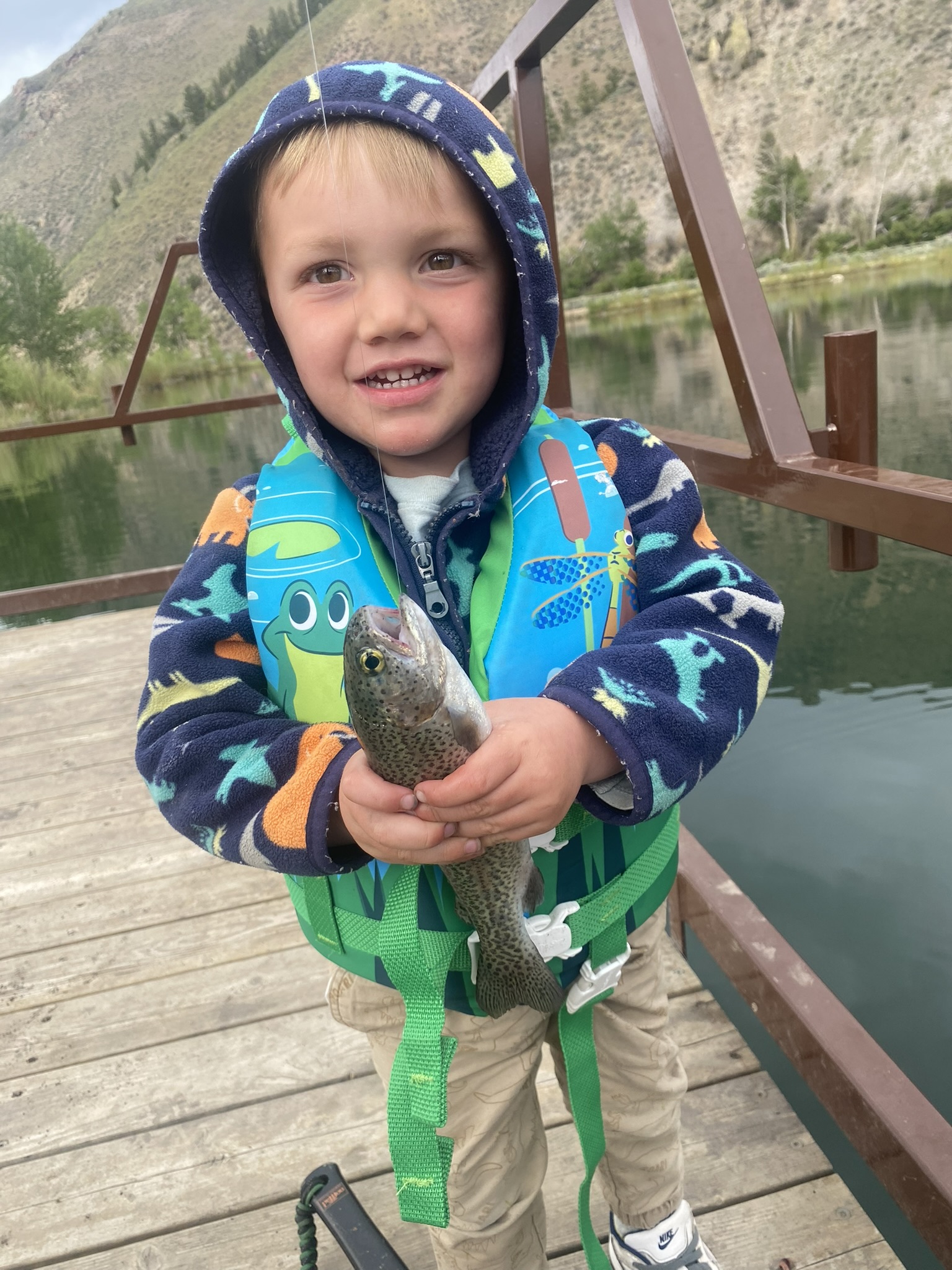 young kid with fish
