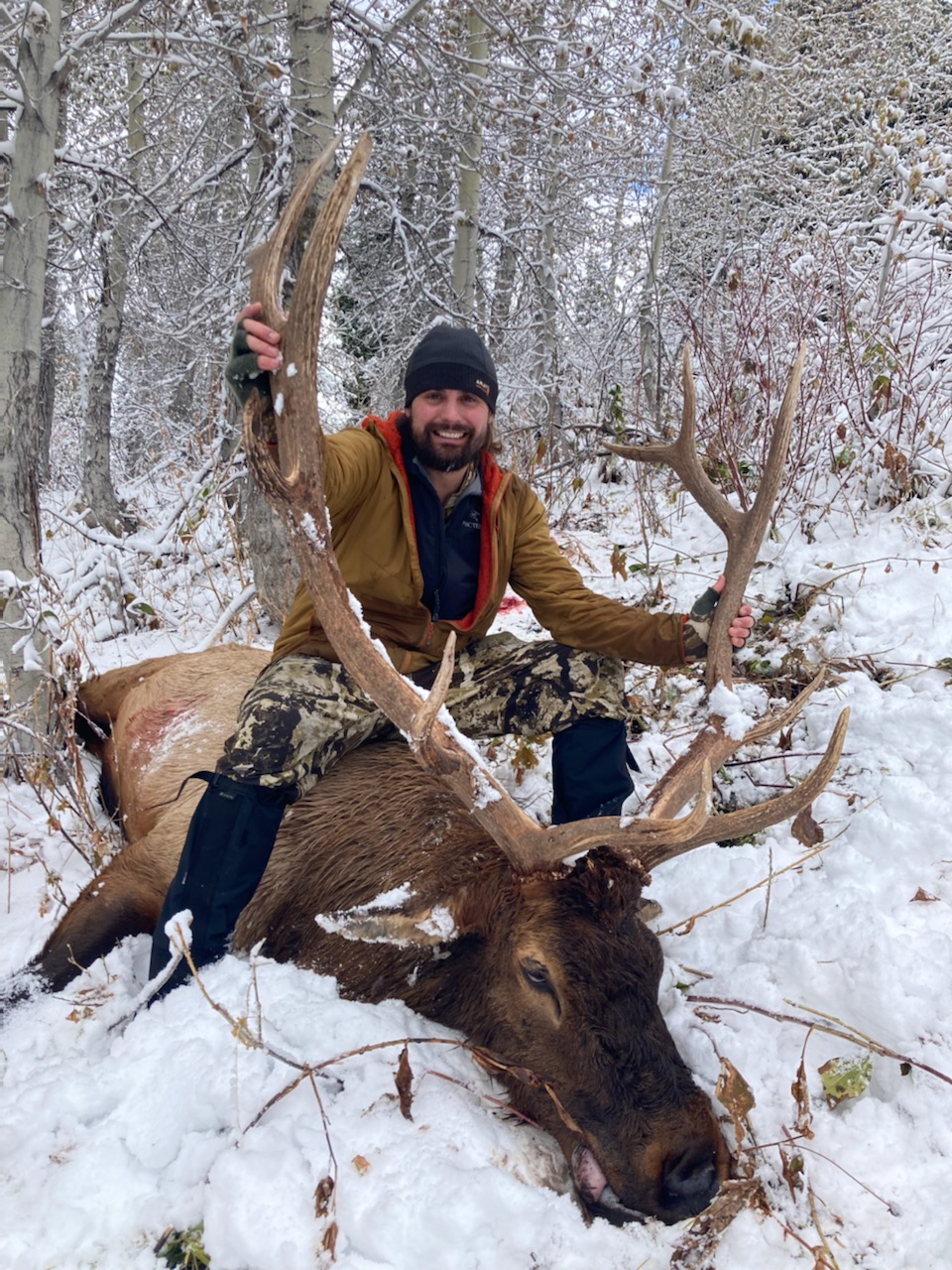 Hunter and bull elk in snow 2022_pc emansfield