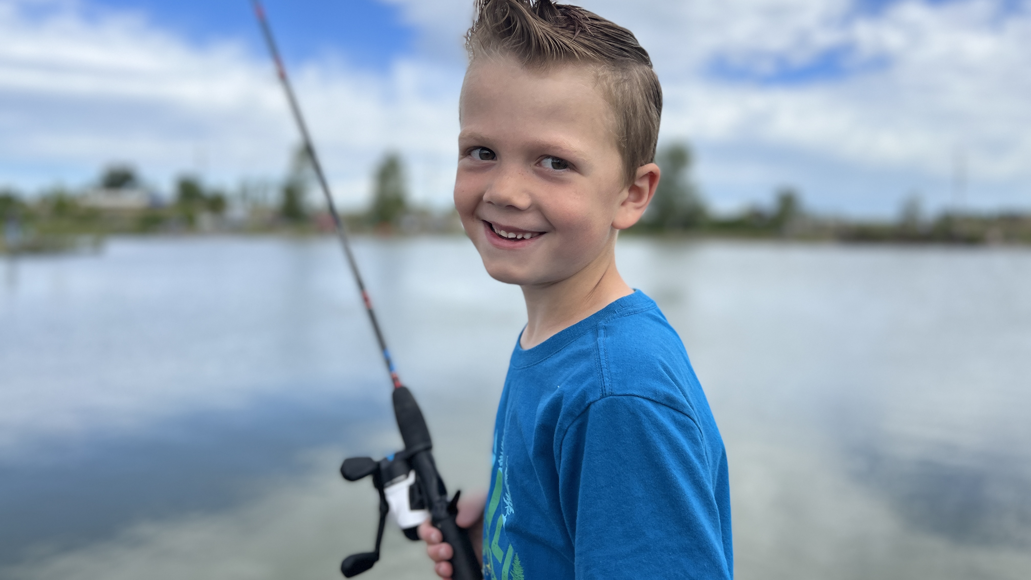 Smiling Kid Fishing