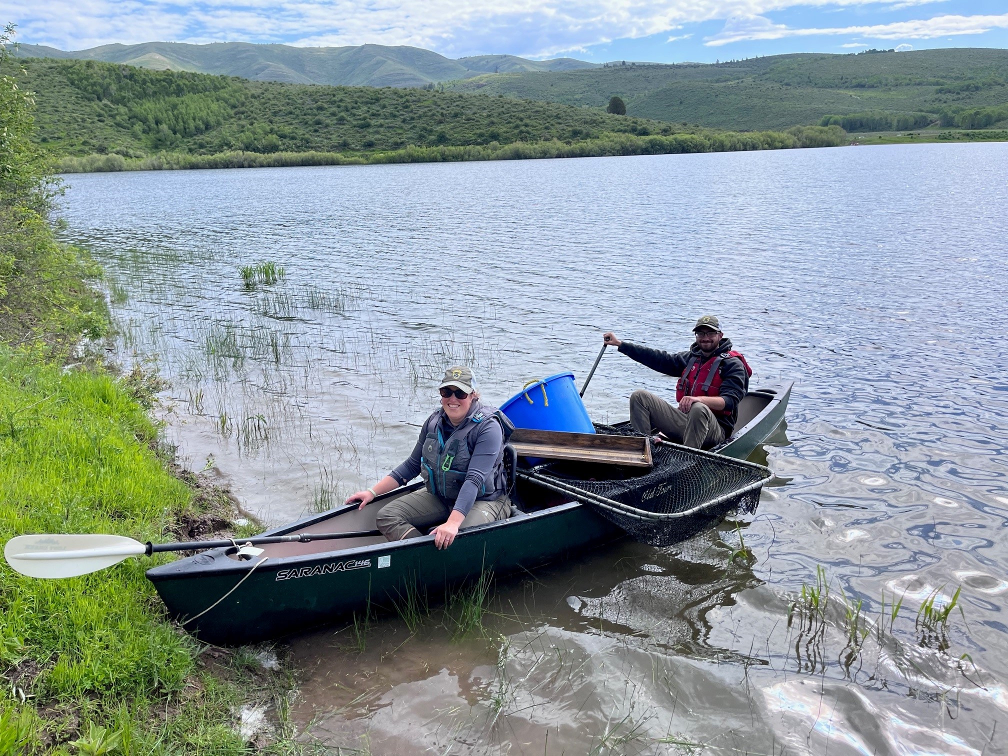 Fisheries staff set gillnets and trapnets from a canoe on Twentyfour Mile Reservoir. 