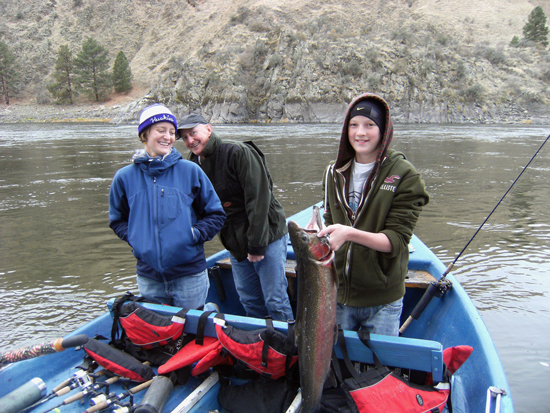 Young angler with steelhead / Photo by Brett Spackman