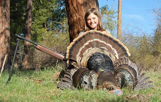 Young girl with turkey