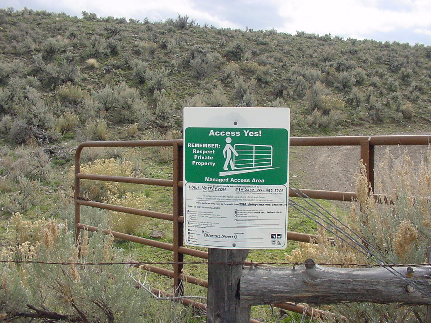  medium shot of an Access Yes sign on a fence post March 2005