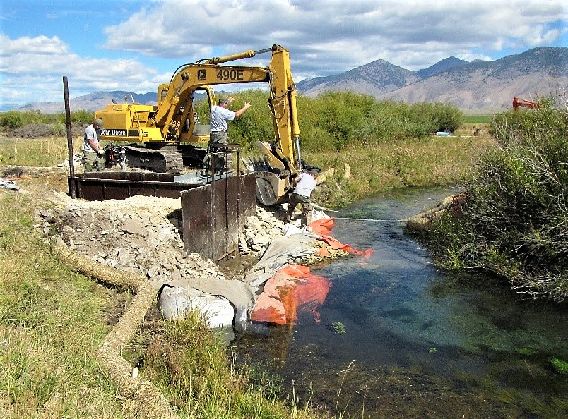 Equipment cleaning a ditch