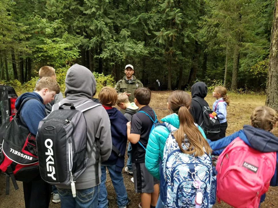 Conservation Officer Jacob Berl speaking to a group of children