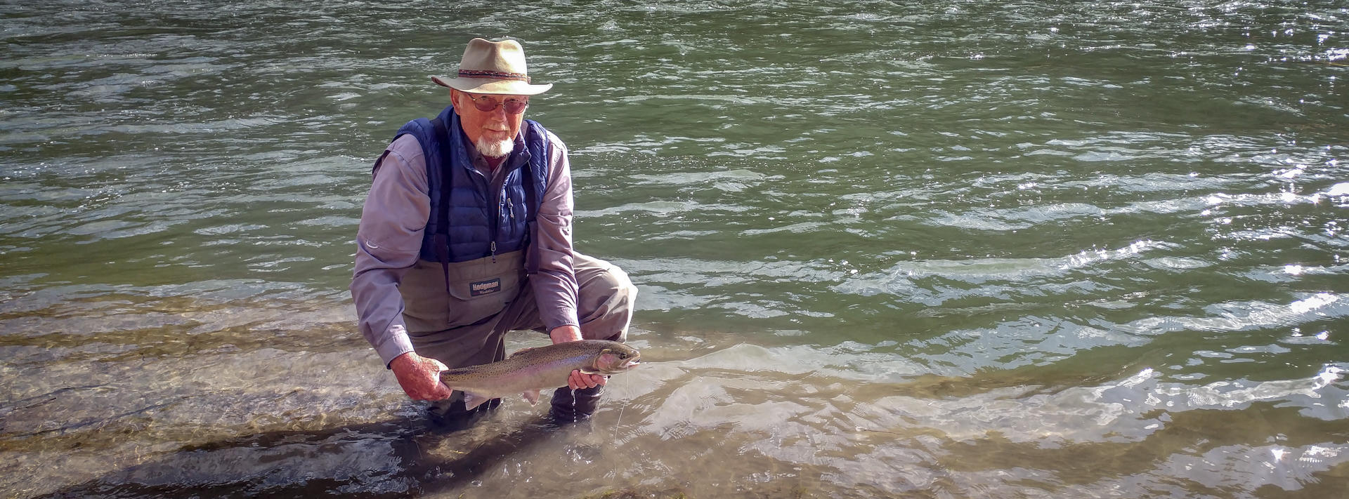 Angler below NF with steelhead