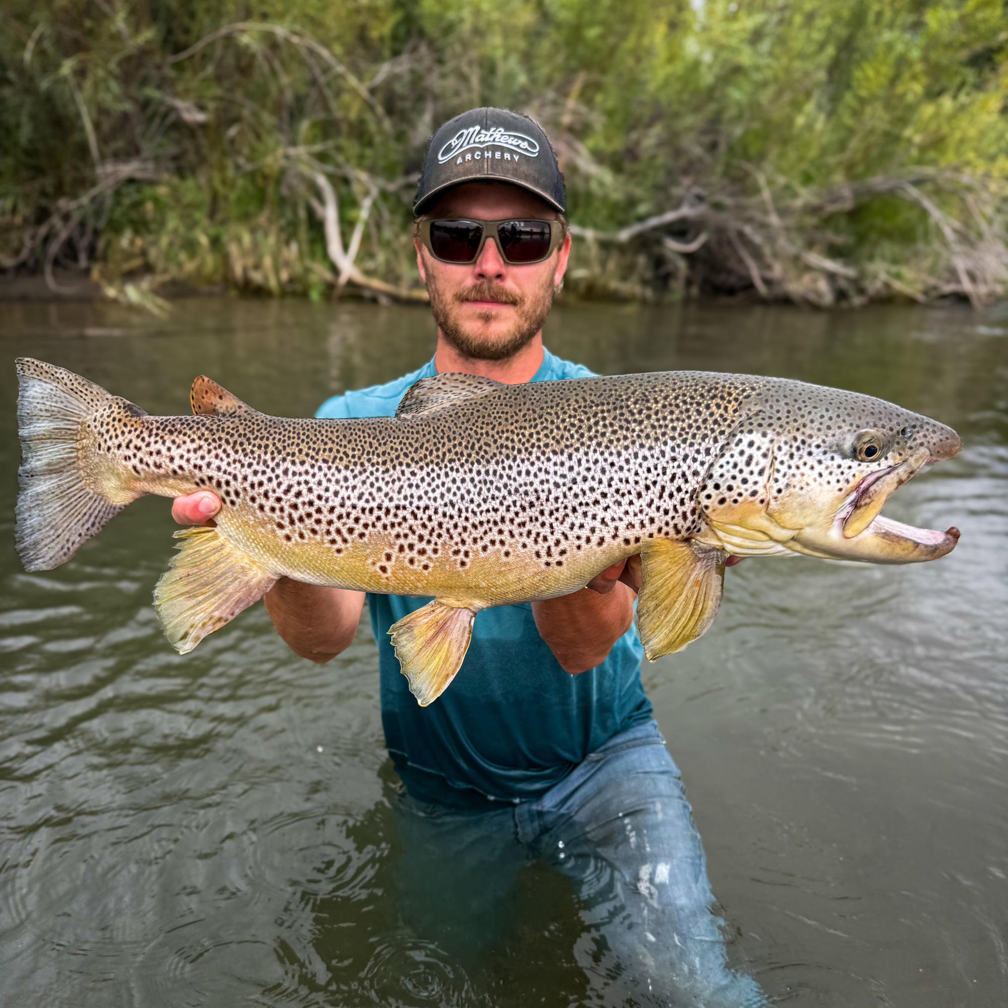 Angler Benjamin Smith with his record brown trout at Bear River 2026