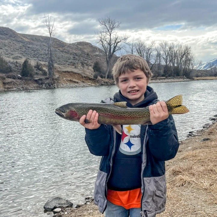 Young angler near Salmon, ID with steelhead