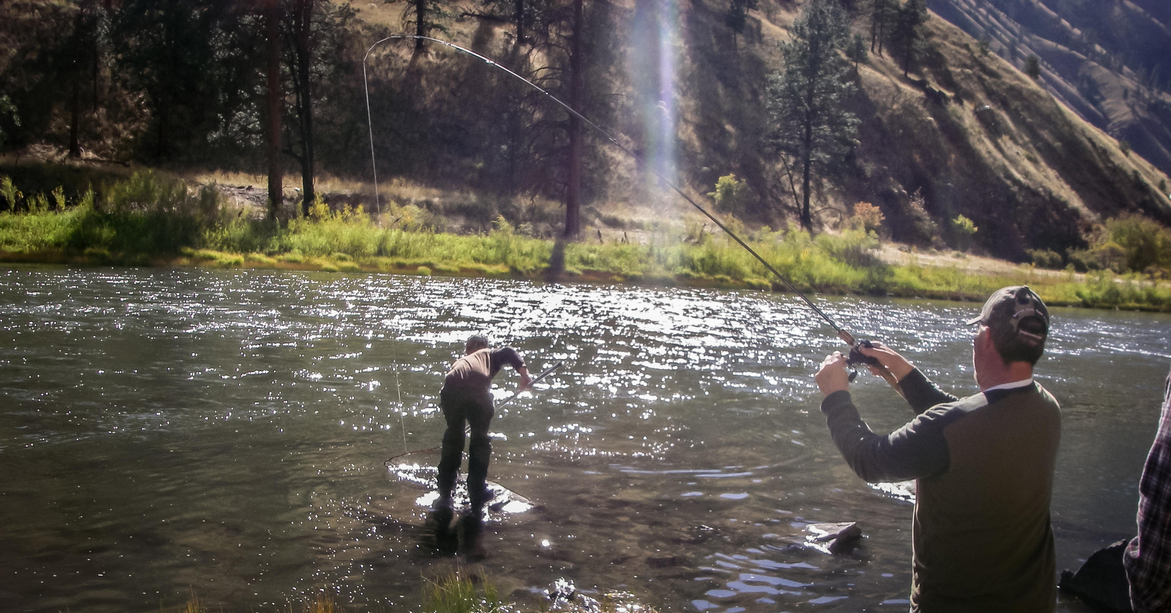 USR steelhead angler landing fish