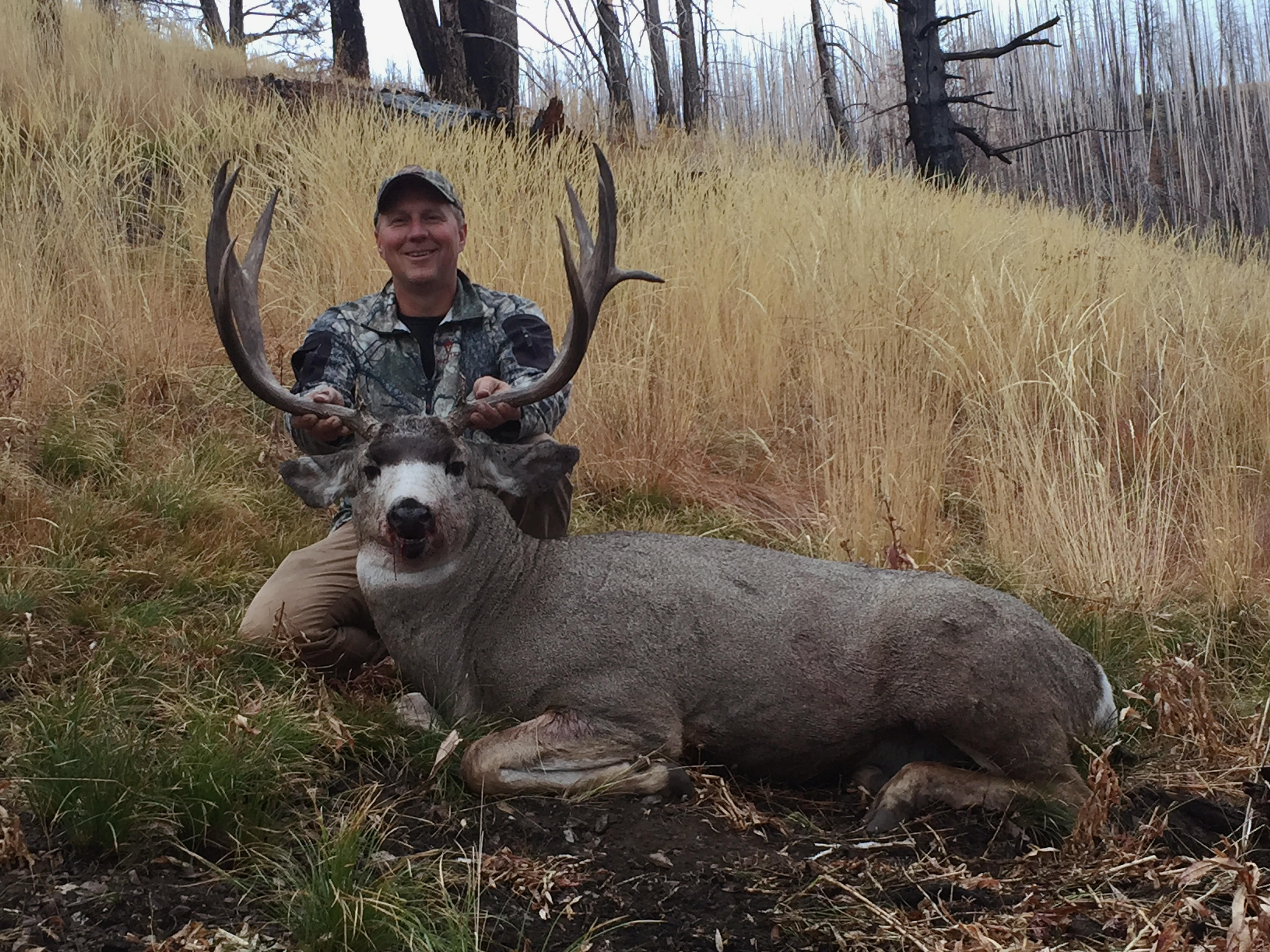 hunter with his mule deer buck October 2015