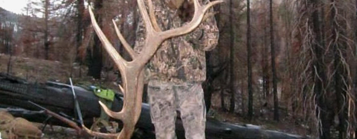 hunter with her trophy elk vertical shot November 2013