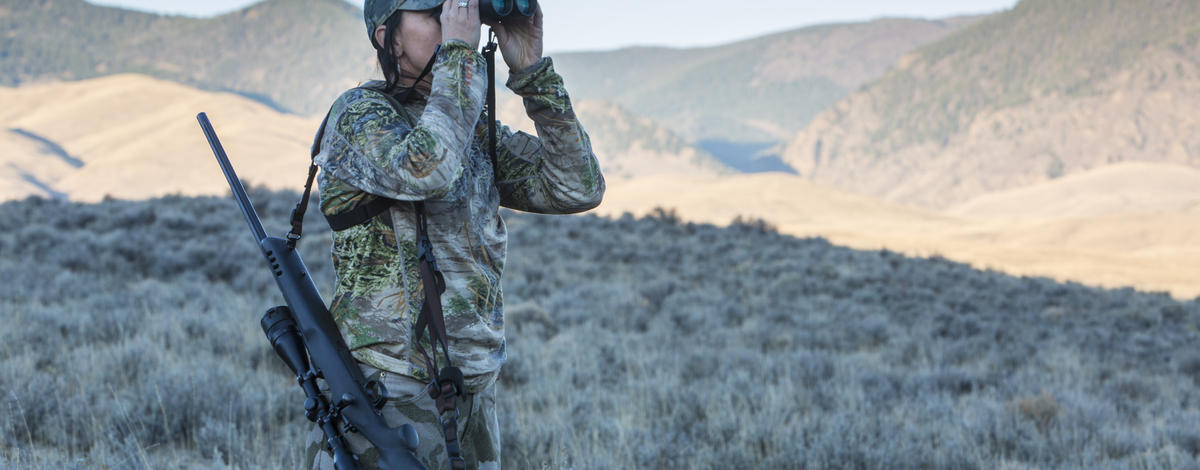 hunter looking in binoculars for her animal Lope hunt October 2015