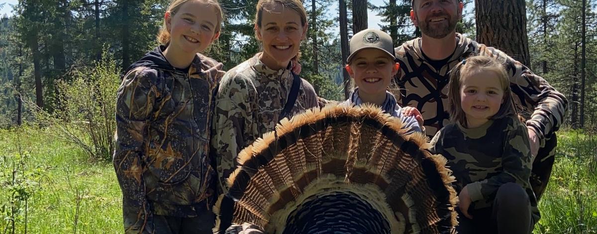 family after successful turkey hunt
