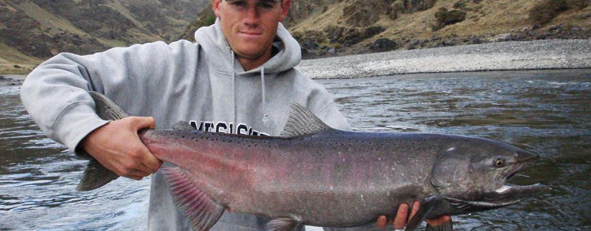 man holding a large Fall chinook