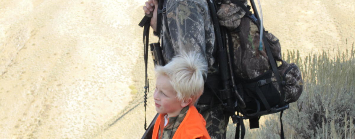 dad and Alex hunt dressed in hunter orange after taking hunter education October 2010