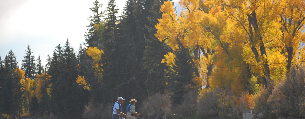 anglers fishing from a boat on a Fall day scenic wide shot October 2008