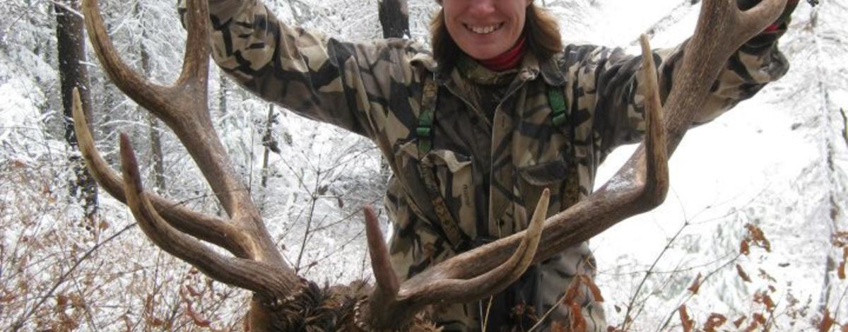 woman with her bull elk 