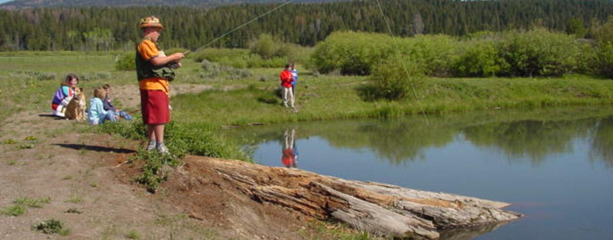 wide shot of kids fishing on Free Fishing Day June 2003