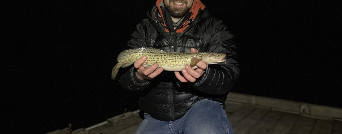 Angler with a burbot from the Kootenai River