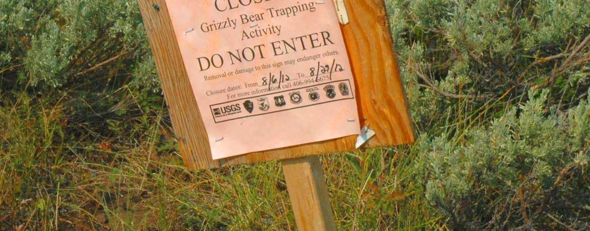 Grizzly bear trapping warning sign