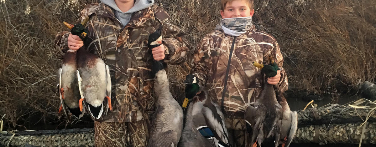 boys with their mallard ducks December 2016 vertical shot