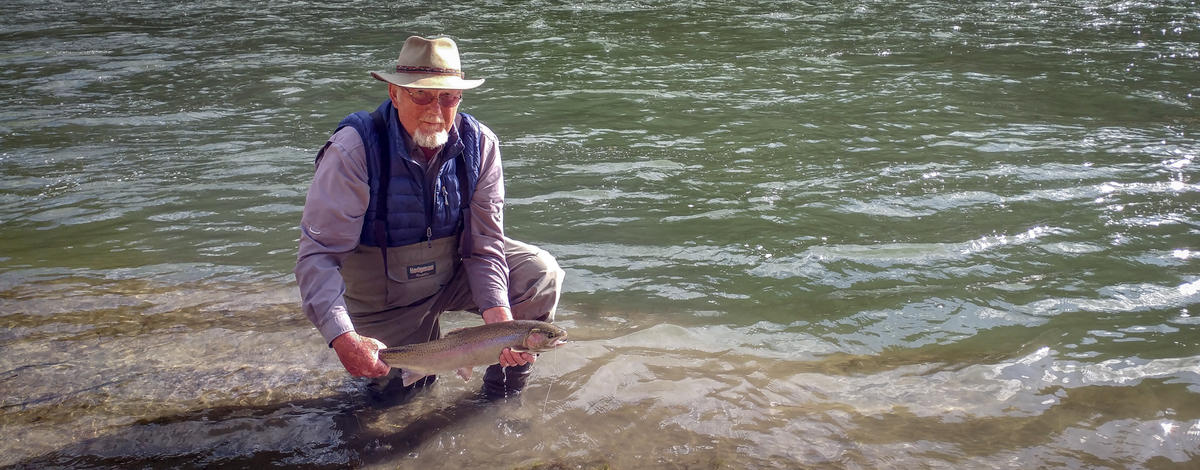 Angler below NF with steelhead