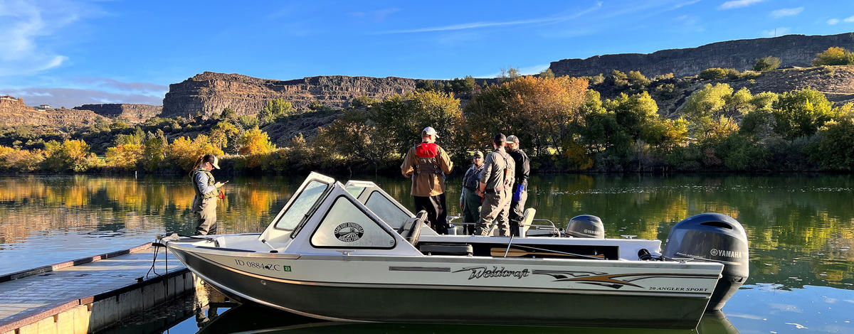 Fish and Game staff plan their day before conducting a fish mortality survey on the Snake River.