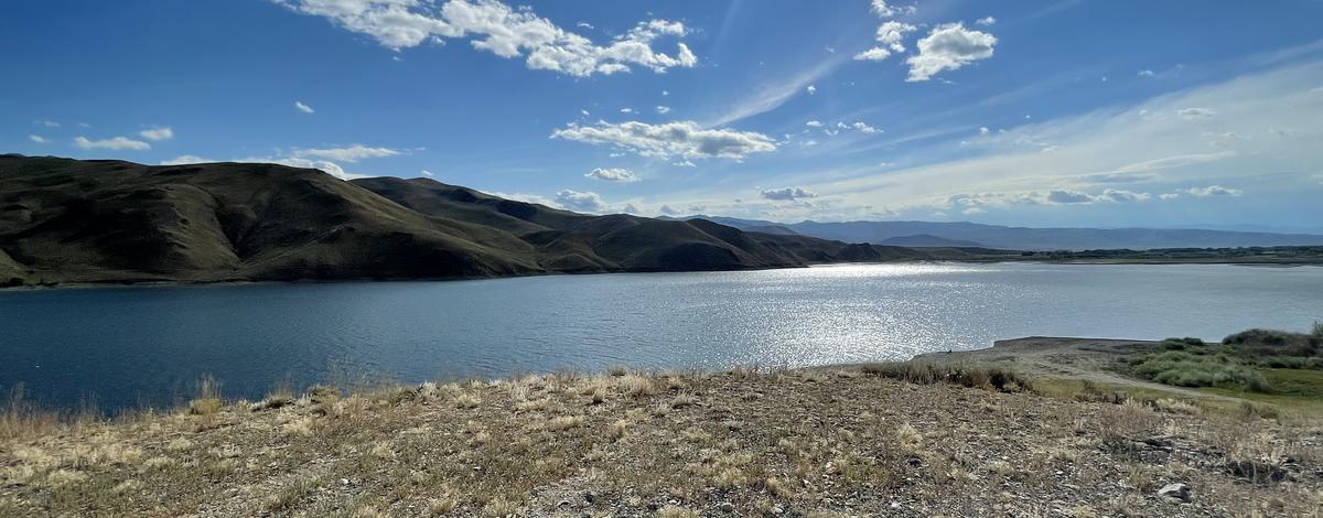 Sun peeking through the clouds over Mackay Reservoir