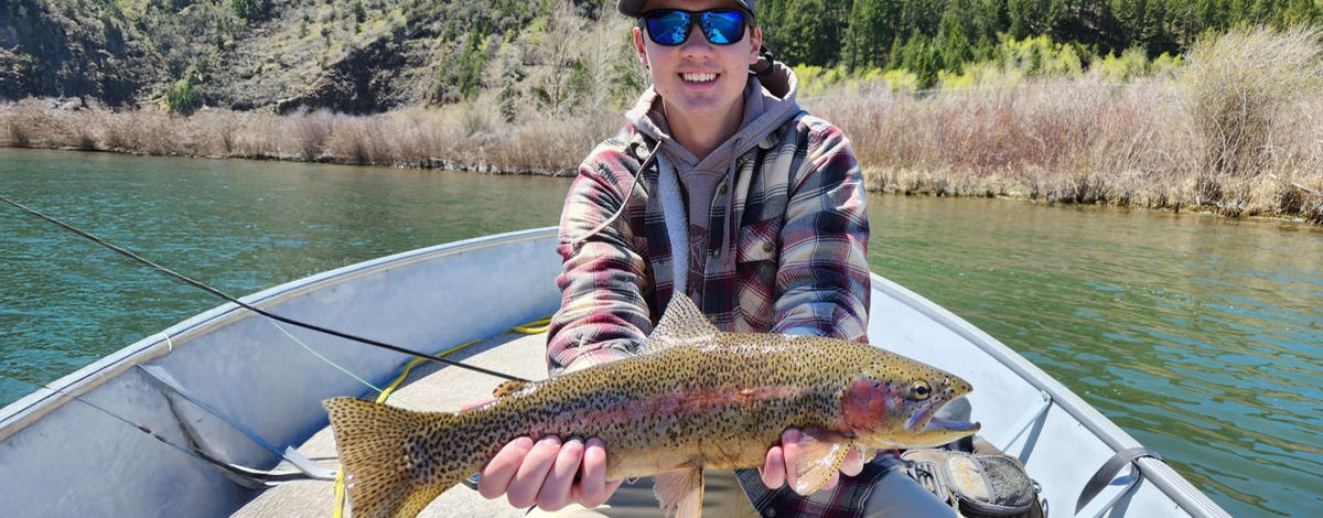 Man holding a large rainbow trout