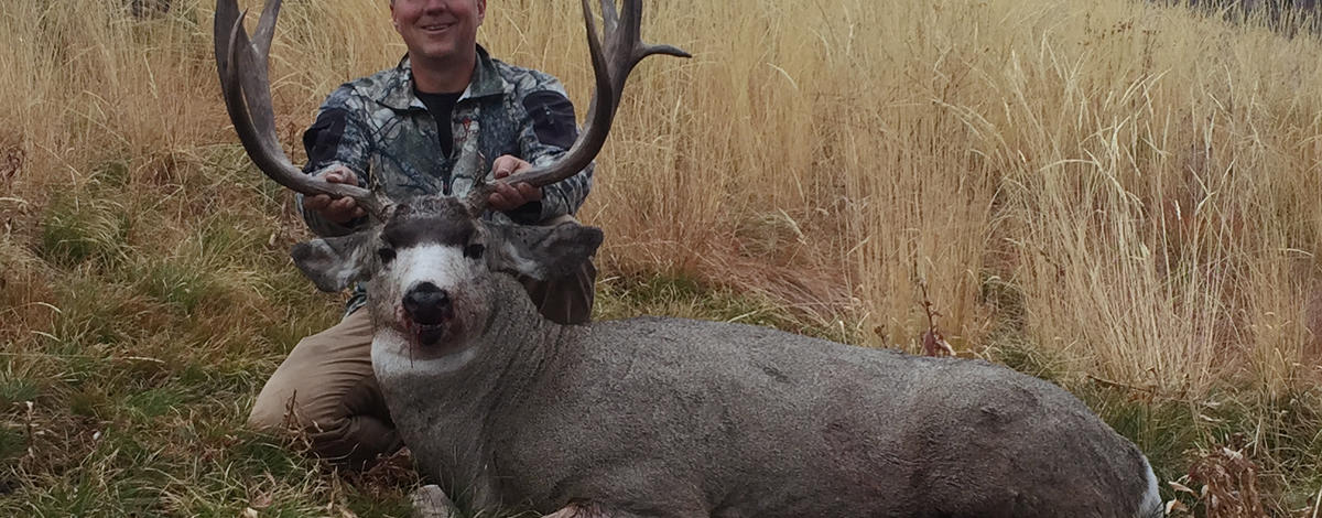hunter with his mule deer buck October 2015