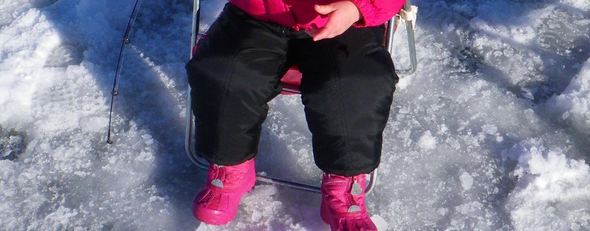 young girl catching her perch during Youth Ice Fishing Day January 2011