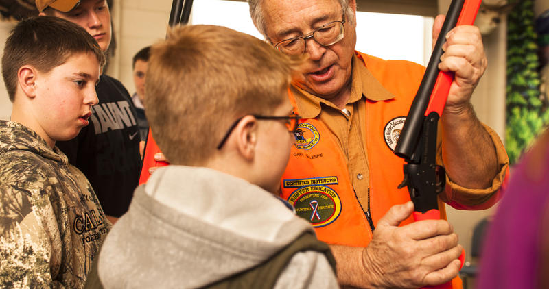 Gary Gillespie instructs students on hunter responsibility and how to use a rifle during a Hunter Education class January 2014