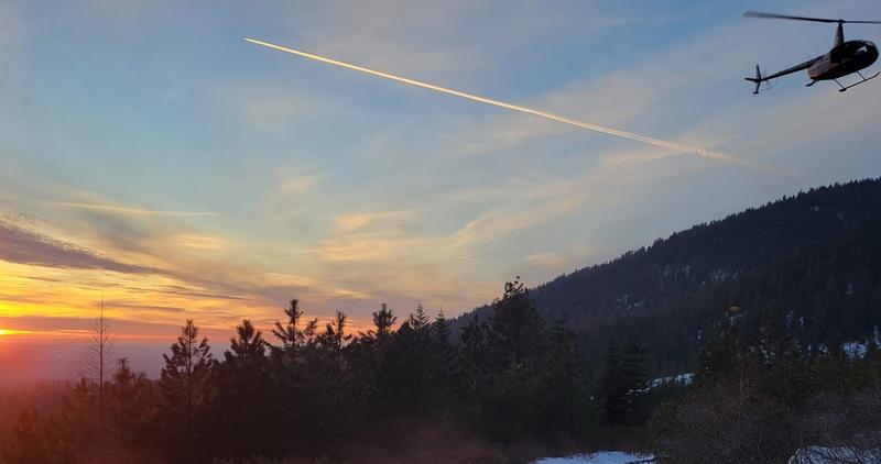 Helicopter in flight for elk captures in North Idaho.