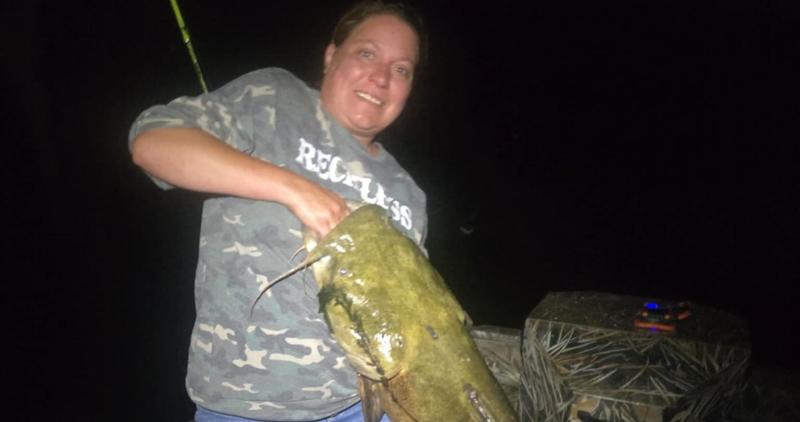 Brandi Holt holding 44-inch flathead catfish from Snake River (horizontal)