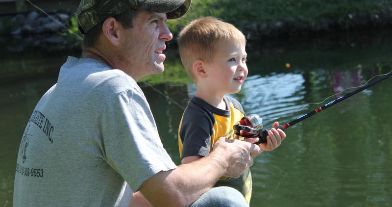 young angler with father