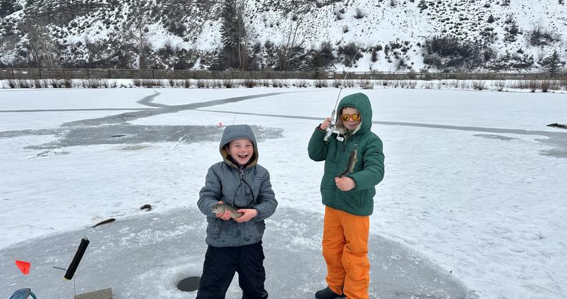 Two local anglers enjoying ice fishing on Johnson Pond