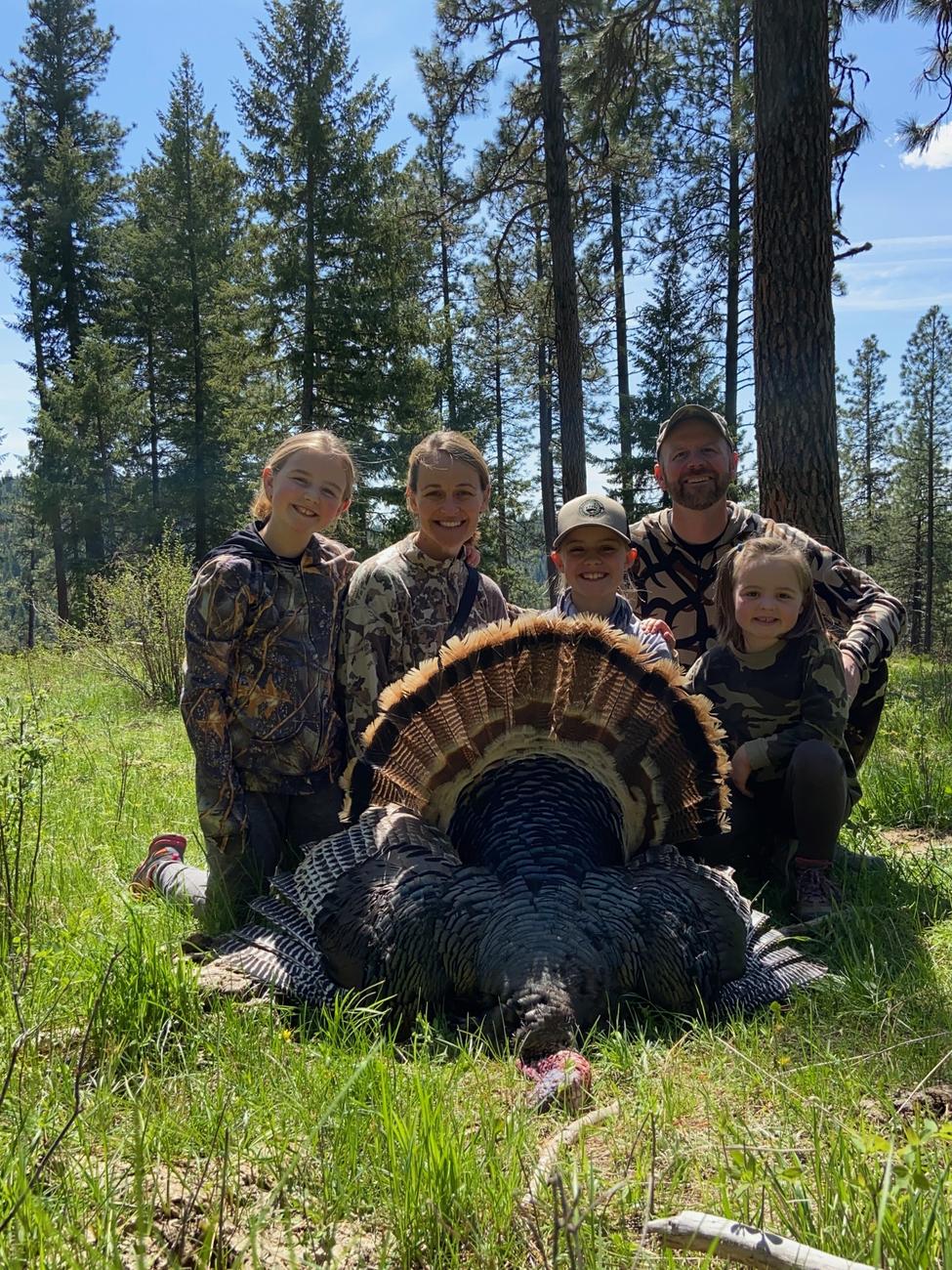 family after successful turkey hunt