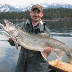 man angler with his large lake trout